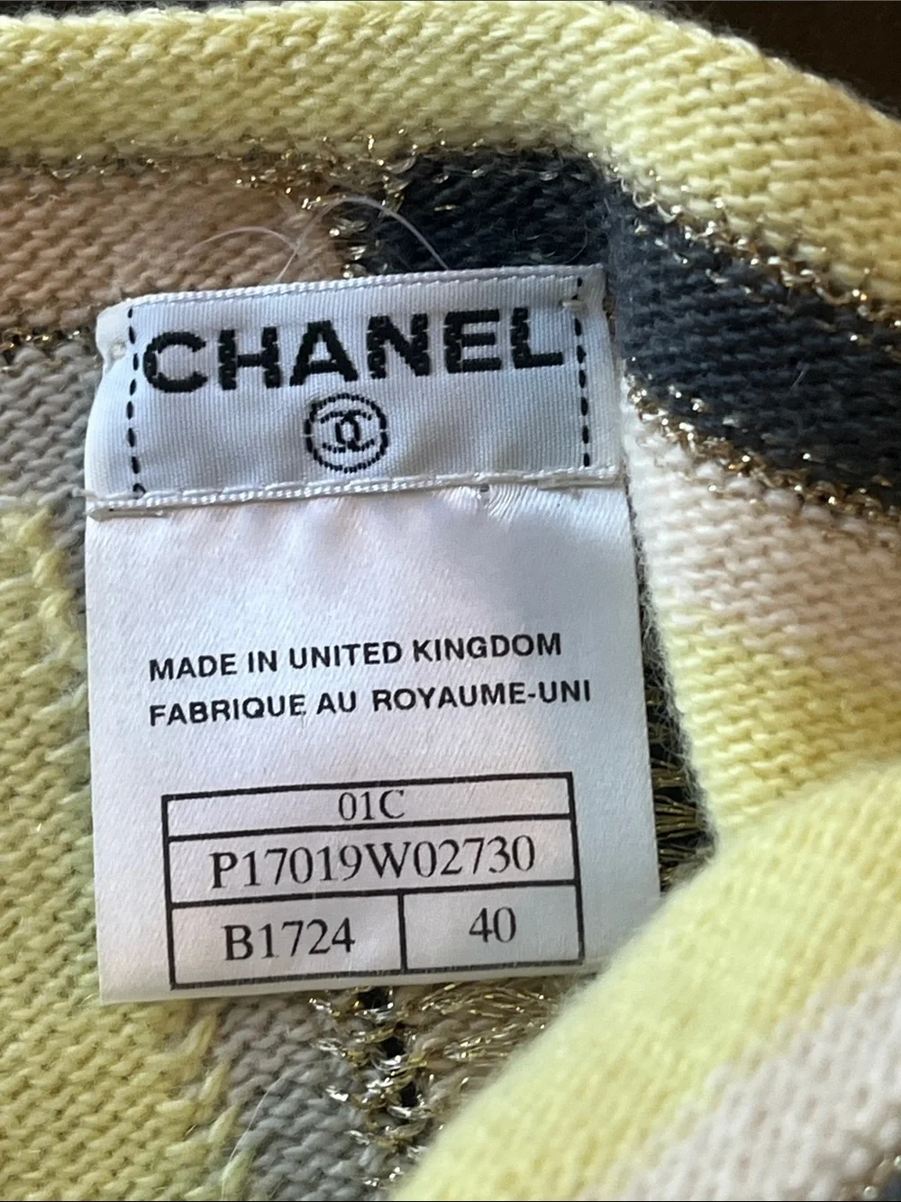 CHANEL Cream Knit Top with Metal Logo Plaque